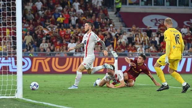 AS Roma's Argentinian forward Paulo Dybala (2ndR) shoots to score his second goal during the Italian Serie A football match between AS Roma and Monza on August 30, 2022 at the Olympic stadium in Rome. (Photo by Alberto PIZZOLI / AFP) (Photo by ALBERTO PIZZOLI/AFP via Getty Images)