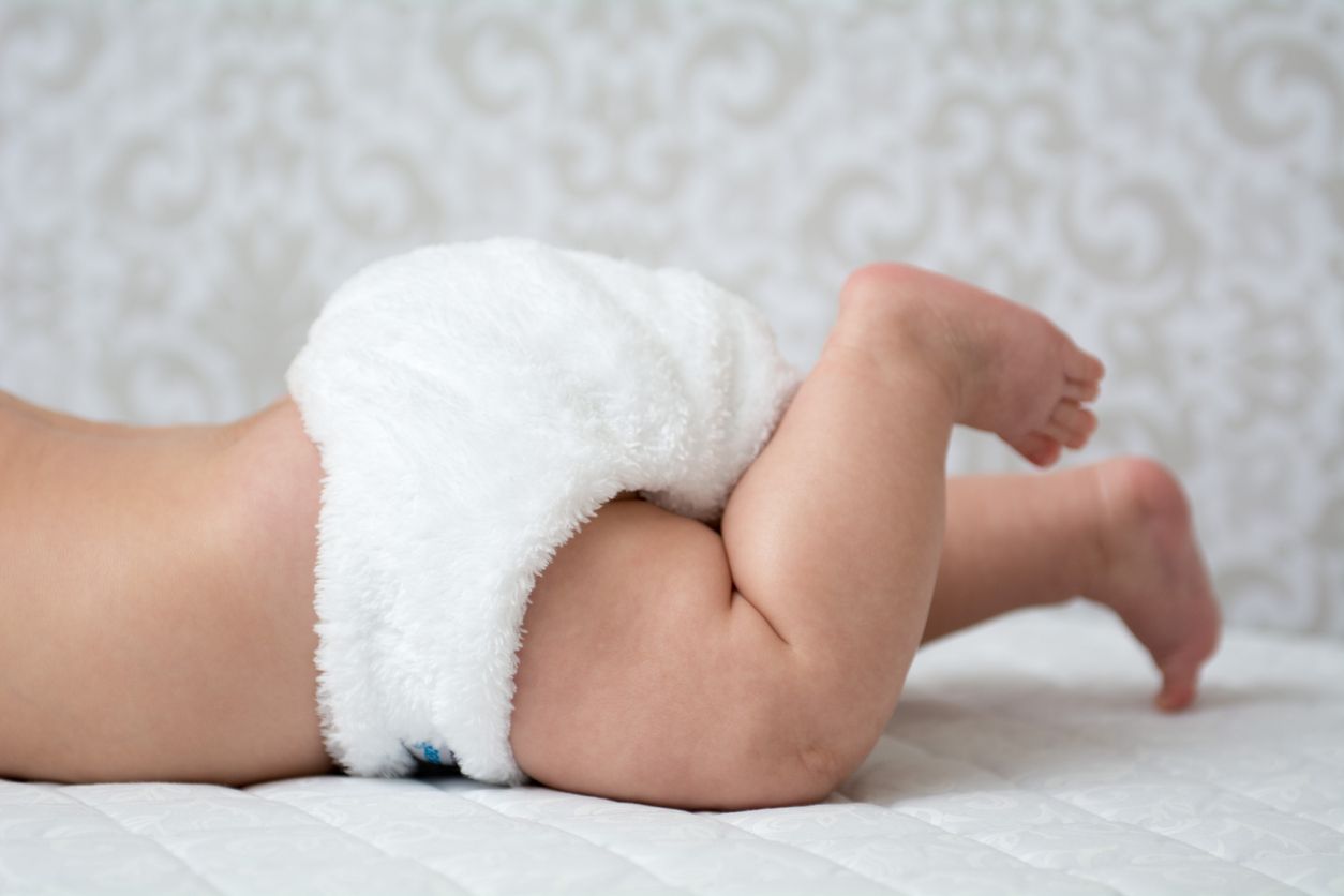 Baby in a white reusable nappy