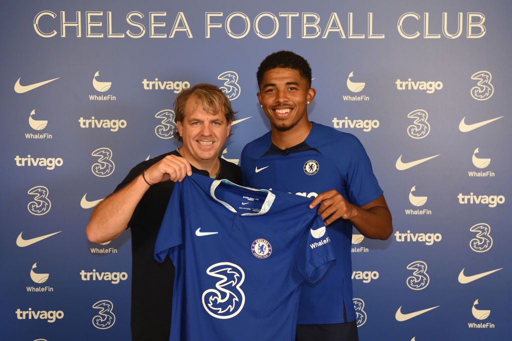 COBHAM, ENGLAND - AUGUST 31: New Chelsea signing Wesley Fofana poses for a photograph with Todd Boehly, Chairman of Chelsea as he signs for Chelsea at Chelsea Training Ground on August 31, 2022 in Cobham, England. (Photo by Harriet Lander - Chelsea FC/Chelsea FC via Getty Images)
