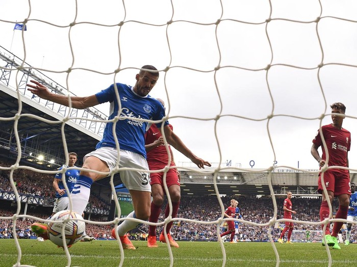 Everton's English defender Conor Coady scores before, after a VAR (Video Assistant Referee) review, his goal is disallowed for offside during the English Premier League football match between Everton and Liverpool at Goodison Park in Liverpool, north west England on September 3, 2022. - - RESTRICTED TO EDITORIAL USE. No use with unauthorized audio, video, data, fixture lists, club/league logos or 'live' services. Online in-match use limited to 120 images. An additional 40 images may be used in extra time. No video emulation. Social media in-match use limited to 120 images. An additional 40 images may be used in extra time. No use in betting publications, games or single club/league/player publications. (Photo by Oli SCARFF / AFP) / RESTRICTED TO EDITORIAL USE. No use with unauthorized audio, video, data, fixture lists, club/league logos or 'live' services. Online in-match use limited to 120 images. An additional 40 images may be used in extra time. No video emulation. Social media in-match use limited to 120 images. An additional 40 images may be used in extra time. No use in betting publications, games or single club/league/player publications. / RESTRICTED TO EDITORIAL USE. No use with unauthorized audio, video, data, fixture lists, club/league logos or 'live' services. Online in-match use limited to 120 images. An additional 40 images may be used in extra time. No video emulation. Social media in-match use limited to 120 images. An additional 40 images may be used in extra time. No use in betting publications, games or single club/league/player publications. (Photo by OLI SCARFF/AFP via Getty Images)
