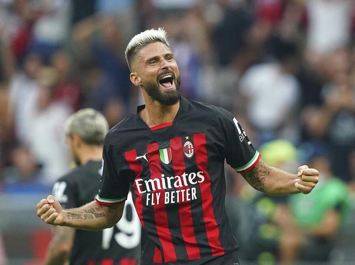 AC Milan's Olivier Giroud celebrates after scoring his side's second goal during the Serie A soccer match between AC Milan and Inter Milan, at the Milan San Siro stadium, Italy, Saturday, Sept. 3, 2022. (Spada/LaPresse via AP)