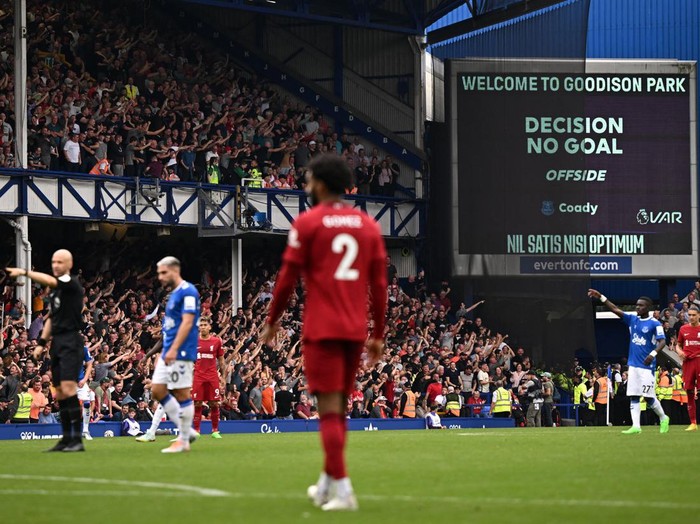 After a VAR (Video Assistant Referee) review, Everton's English defender Conor Coady has his goal disallowed for offside during the English Premier League football match between Everton and Liverpool at Goodison Park in Liverpool, north west England on September 3, 2022. - RESTRICTED TO EDITORIAL USE. No use with unauthorized audio, video, data, fixture lists, club/league logos or 'live' services. Online in-match use limited to 120 images. An additional 40 images may be used in extra time. No video emulation. Social media in-match use limited to 120 images. An additional 40 images may be used in extra time. No use in betting publications, games or single club/league/player publications. (Photo by Oli SCARFF / AFP) / RESTRICTED TO EDITORIAL USE. No use with unauthorized audio, video, data, fixture lists, club/league logos or 'live' services. Online in-match use limited to 120 images. An additional 40 images may be used in extra time. No video emulation. Social media in-match use limited to 120 images. An additional 40 images may be used in extra time. No use in betting publications, games or single club/league/player publications. / RESTRICTED TO EDITORIAL USE. No use with unauthorized audio, video, data, fixture lists, club/league logos or 'live' services. Online in-match use limited to 120 images. An additional 40 images may be used in extra time. No video emulation. Social media in-match use limited to 120 images. An additional 40 images may be used in extra time. No use in betting publications, games or single club/league/player publications. (Photo by OLI SCARFF/AFP via Getty Images)