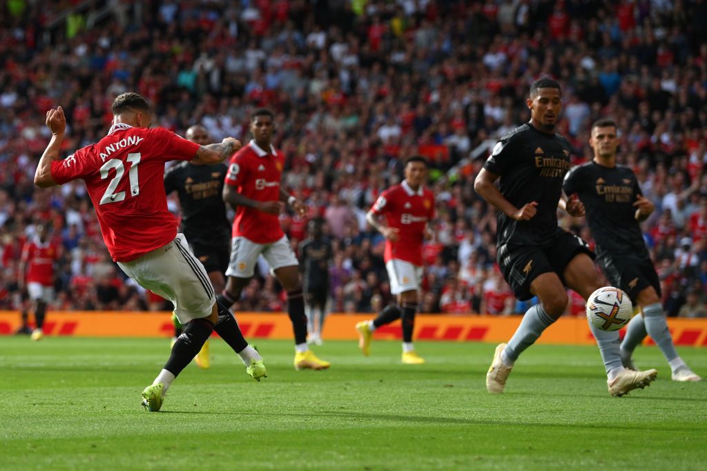 MANCHESTER, ENGLAND - SEPTEMBER 04: Antony of Manchester United celebrates with team mates Scott McTominay and Marcus Rashford after scoring their sides first goal during the Premier League match between Manchester United and Arsenal FC at Old Trafford on September 04, 2022 in Manchester, England. (Photo by Shaun Botterill/Getty Images)