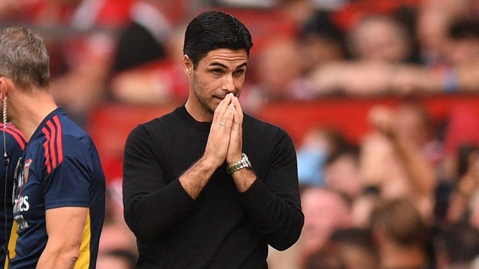 Arsenals Spanish manager Mikel Arteta reacts after their first goal is disallowed after a VAR (Video Assistant Referee) review during the English Premier League football match between Manchester United and Arsenal at Old Trafford in Manchester, north west England, on September 4, 2022. - RESTRICTED TO EDITORIAL USE. No use with unauthorized audio, video, data, fixture lists, club/league logos or live services. Online in-match use limited to 120 images. An additional 40 images may be used in extra time. No video emulation. Social media in-match use limited to 120 images. An additional 40 images may be used in extra time. No use in betting publications, games or single club/league/player publications. (Photo by Oli SCARFF / AFP) / RESTRICTED TO EDITORIAL USE. No use with unauthorized audio, video, data, fixture lists, club/league logos or live services. Online in-match use limited to 120 images. An additional 40 images may be used in extra time. No video emulation. Social media in-match use limited to 120 images. An additional 40 images may be used in extra time. No use in betting publications, games or single club/league/player publications. / RESTRICTED TO EDITORIAL USE. No use with unauthorized audio, video, data, fixture lists, club/league logos or live services. Online in-match use limited to 120 images. An additional 40 images may be used in extra time. No video emulation. Social media in-match use limited to 120 images. An additional 40 images may be used in extra time. No use in betting publications, games or single club/league/player publications. (Photo by OLI SCARFF/AFP via Getty Images)