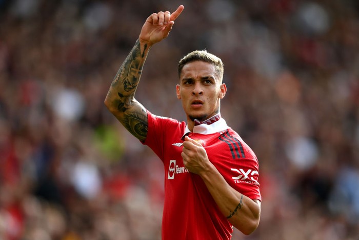 Antony MANCHESTER, ENGLAND - SEPTEMBER 04: Antony of Manchester United celebrates after scoring their sides first goal during the Premier League match between Manchester United and Arsenal FC at Old Trafford on September 04, 2022 in Manchester, England. (Photo by Shaun Botterill/Getty Images)