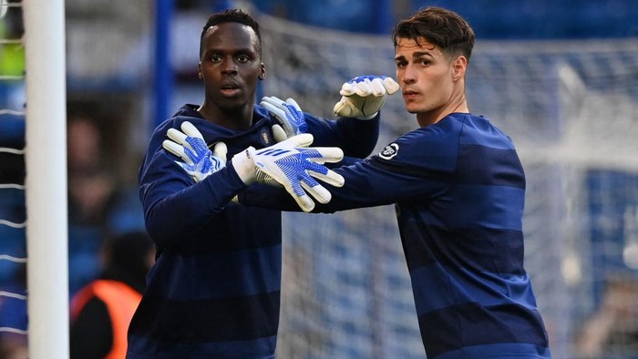 Chelseas French-born Senegalese goalkeeper Edouard Mendy (L) and Chelseas Spanish goalkeeper Kepa Arrizabalaga (R) warm up ahead of the English Premier League football match between Chelsea and Leicester City at Stamford Bridge in London on May 19, 2022. - RESTRICTED TO EDITORIAL USE. No use with unauthorized audio, video, data, fixture lists, club/league logos or live services. Online in-match use limited to 120 images. An additional 40 images may be used in extra time. No video emulation. Social media in-match use limited to 120 images. An additional 40 images may be used in extra time. No use in betting publications, games or single club/league/player publications. (Photo by Glyn KIRK / AFP) / RESTRICTED TO EDITORIAL USE. No use with unauthorized audio, video, data, fixture lists, club/league logos or live services. Online in-match use limited to 120 images. An additional 40 images may be used in extra time. No video emulation. Social media in-match use limited to 120 images. An additional 40 images may be used in extra time. No use in betting publications, games or single club/league/player publications. / RESTRICTED TO EDITORIAL USE. No use with unauthorized audio, video, data, fixture lists, club/league logos or live services. Online in-match use limited to 120 images. An additional 40 images may be used in extra time. No video emulation. Social media in-match use limited to 120 images. An additional 40 images may be used in extra time. No use in betting publications, games or single club/league/player publications. (Photo by GLYN KIRK/AFP via Getty Images)
