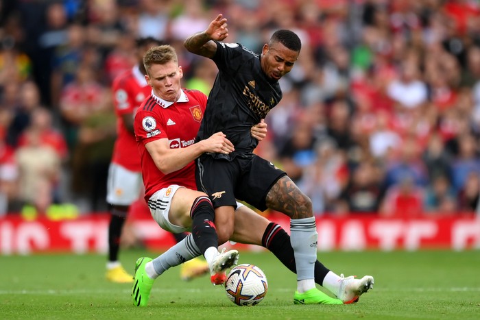 MANCHESTER, ENGLAND - SEPTEMBER 04: Scott McTominay of Manchester United tackles Gabriel Jesus of Arsenal during the Premier League match between Manchester United and Arsenal FC at Old Trafford on September 04, 2022 in Manchester, England. (Photo by Shaun Botterill/Getty Images)