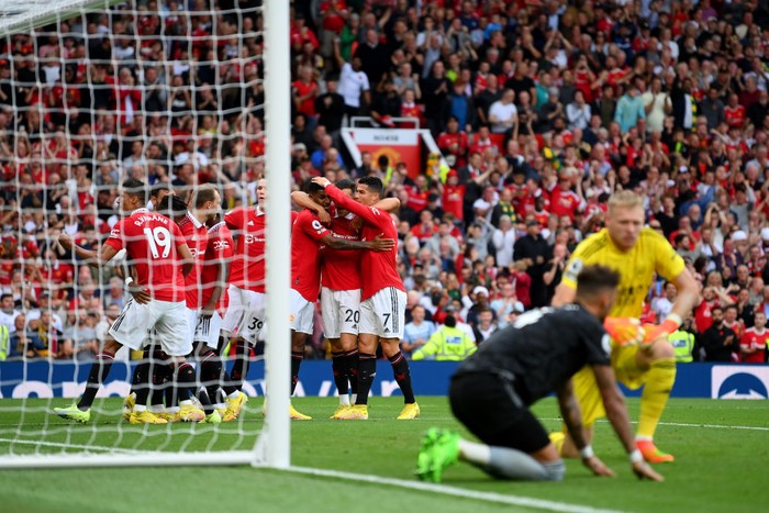 MANCHESTER, ENGLAND - SEPTEMBER 04: Marcus Rashford of Manchester United celebrates with team mates after scoring their sides third goal during the Premier League match between Manchester United and Arsenal FC at Old Trafford on September 04, 2022 in Manchester, England. (Photo by Michael Regan/Getty Images)