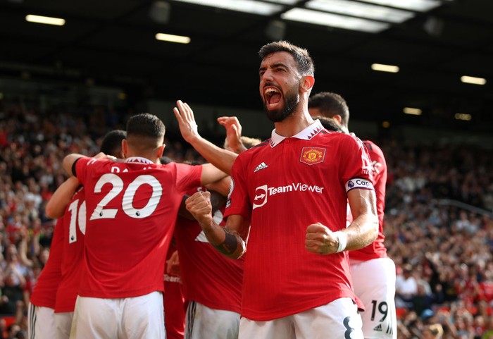 MANCHESTER, ENGLAND - SEPTEMBER 04:  Bruno Fernandes of Manchester United celebrates after Antony of Manchester United scores their sides first goal during the Premier League match between Manchester United and Arsenal FC at Old Trafford on September 04, 2022 in Manchester, England. (Photo by Shaun Botterill/Getty Images)