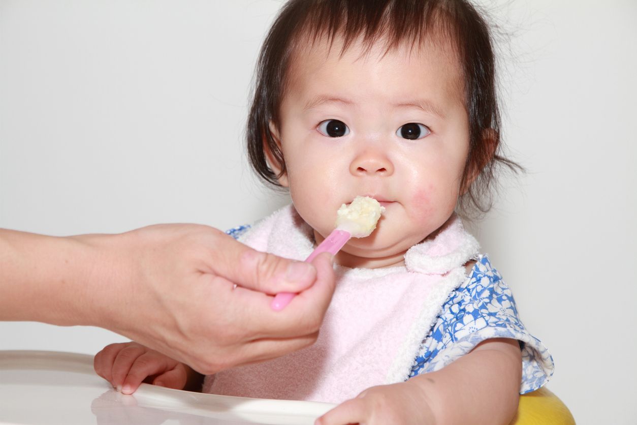 Japanese baby girl eating baby food (0 year old)