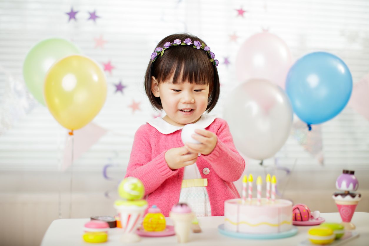 toddler girl celebrating her third birthday at home