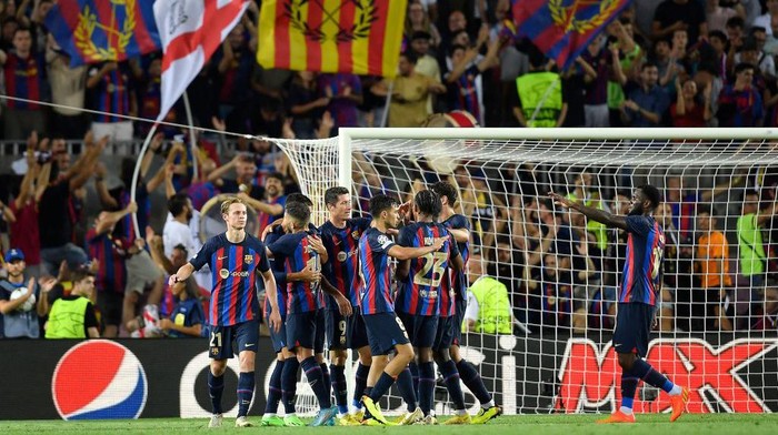Barcelonas German goalkeeper Marc-Andre ter Stegen (R) deflects the ball next to Viktoria Plzens Czech defender Lukas Hejda (L) and Barcelonas Spanish defender Gerard Pique during the UEFA Champions League Group C first-leg football match between FC Barcelona and Viktoria Plzen, at the Camp Nou stadium in Barcelona on September 7, 2022. (Photo by Pau BARRENA / AFP) (Photo by PAU BARRENA/AFP via Getty Images)