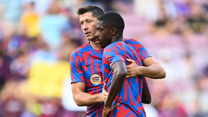 BARCELONA, SPAIN - AUGUST 28: Robert Lewandowski of FC Barcelona hugs his team mate Ousmane Dembele of FC Barcelona during the LaLiga Santander match between FC Barcelona and Real Valladolid CF at Camp Nou on August 28, 2022 in Barcelona, Spain. (Photo by David Ramos/Getty Images)