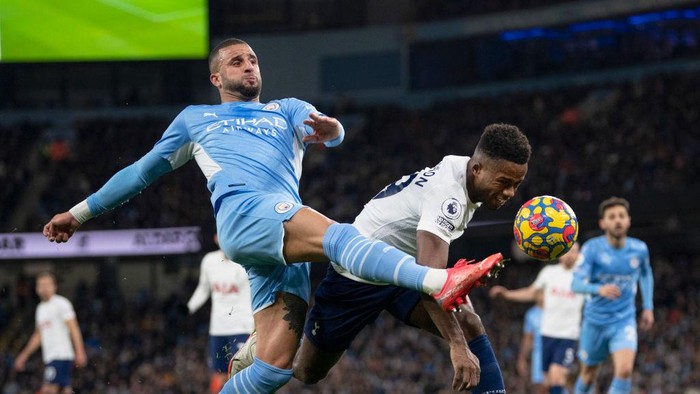 MANCHESTER, ENGLAND - FEBRUARY 19: Kyle Walker of Manchester City and Ryan Sessegnon of Tottenham Hotspur in action during the Premier League match between Manchester City and Tottenham Hotspur at Etihad Stadium on February 19, 2022 in Manchester, United Kingdom. (Photo by Visionhaus/Getty Images)