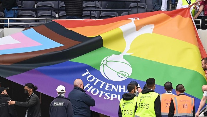 LONDON, ENGLAND - AUGUST 15: A Tottenham Hotspur rainbow flag is seen being removed by Manchester City fans following during the Premier League match between Tottenham Hotspur and Manchester City at Tottenham Hotspur Stadium on August 15, 2021 in London, England. (Photo by Michael Regan/Getty Images)