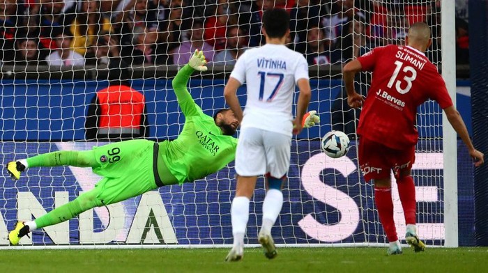 Paris Saint-Germains Italian goalkeeper Gianluigi Donnarumma dives to intercept a penalty kick during the French L1 football match between Paris Saint-Germain (PSG) and Stade Brestois 29 (Brest) at the Parc des Princes Stadium in Paris on September 10, 2022. (Photo by Anne-Christine POUJOULAT / AFP) (Photo by ANNE-CHRISTINE POUJOULAT/AFP via Getty Images)