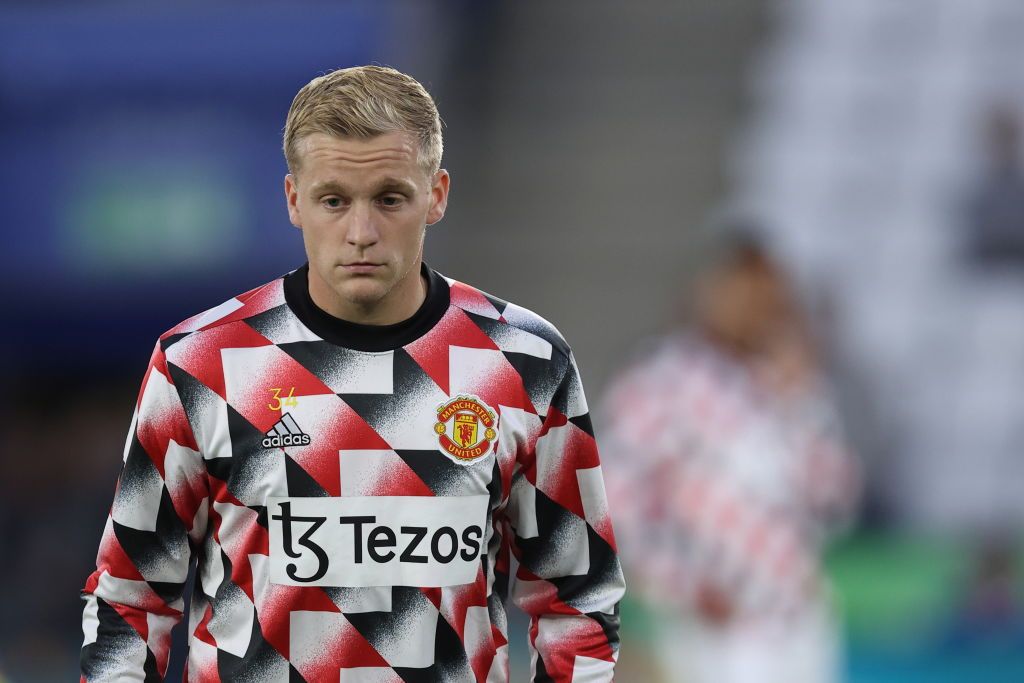 MANCHESTER, ENGLAND - AUGUST 07: Donny van de Beek of Manchester United throws a note to Harry Maguire during the Premier League match between Manchester United and Brighton & Hove Albion at Old Trafford on August 07, 2022 in Manchester, England. (Photo by Catherine Ivill/Getty Images)