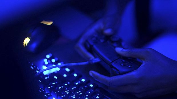 Founder of Melanin Gamers Annabel Ashalley-Anthony, 30, competes in an online tournament at Arena 233, an e-sports hub, in Accra, Ghana, August 21, 2022. REUTERS/Francis Kokoroko