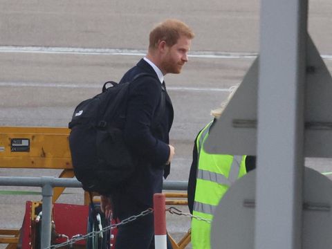 Britain's Prince Harry boards a plane at Aberdeen International Airport, following the passing of Britain's Queen Elizabeth, in Aberdeen, Britain, September 9, 2022. REUTERS/Phil Noble