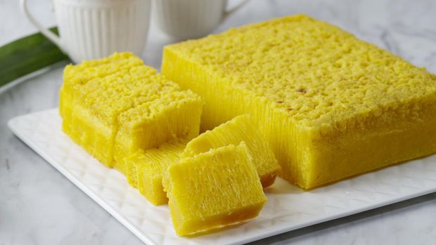 Bika Ambon, Popular Jajanan Pasar from Medan, North Sumatera. Indonesian Honeycomb Cake with Square Slices in White Plate