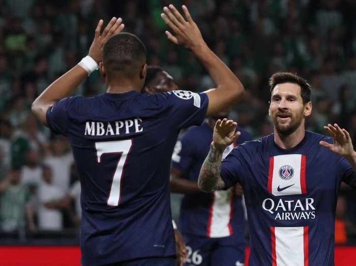 Paris Saint-Germain's Argentine forward Lionel Messi (R) celebrates scoring the equaliser with Paris Saint-Germain's French forward Kylian Mbappe during the UEFA Champions League group H football match between Israel's Maccabi Haifa and France's Paris Saint-Germain (PSG) at the Sammy Ofer stadium in the city of Haifa on September 14, 2022. (Photo by JACK GUEZ / AFP) (Photo by JACK GUEZ/AFP via Getty Images)