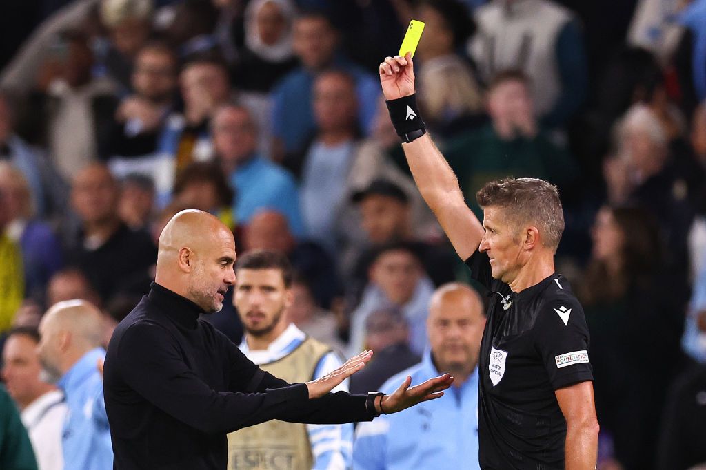 MANCHESTER, ENGLAND - SEPTEMBER 14:  Pep Guardiola manager of Manchester City and Phil Foden confront Referee Daniele Orsato at full time during the UEFA Champions League group G match between Manchester City and Borussia Dortmund at Etihad Stadium on September 14, 2022 in Manchester, United Kingdom. (Photo by Marc Atkins/Getty Images)