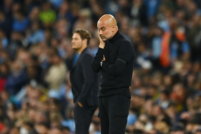MANCHESTER, ENGLAND - SEPTEMBER 14: Pep Guardiola, Manager of Manchester City looks dejected during the UEFA Champions League group G match between Manchester City and Borussia Dortmund at Etihad Stadium on September 14, 2022 in Manchester, England. (Photo by Michael Regan/Getty Images)