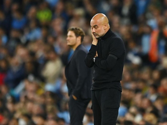 MANCHESTER, ENGLAND - SEPTEMBER 14: Pep Guardiola, Manager of Manchester City looks dejected during the UEFA Champions League group G match between Manchester City and Borussia Dortmund at Etihad Stadium on September 14, 2022 in Manchester, England. (Photo by Michael Regan/Getty Images)