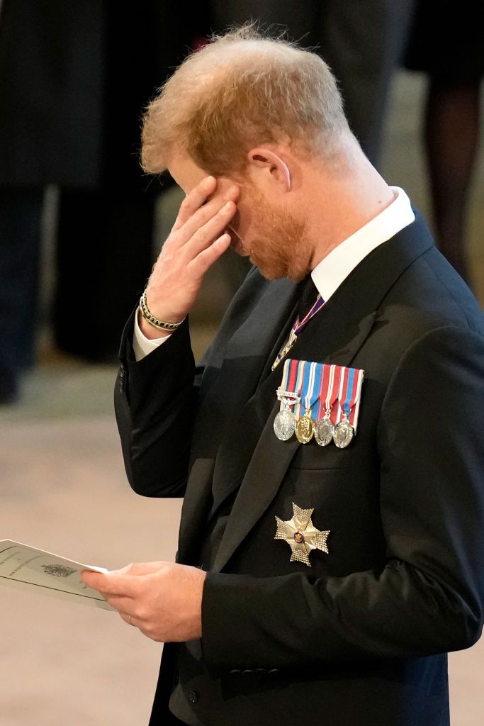 LONDON, UNITED KINGDOM - SEPTEMBER 14: (EMBARGOED FOR PUBLICATION IN UK NEWSPAPERS UNTIL 24 HOURS AFTER CREATE DATE AND TIME) Prince Harry, Duke of Sussex walks behind Queen Elizabeth II's coffin as it is transported on a gun carriage from Buckingham Palace to The Palace of Westminster ahead of her Lying-in-State on September 14, 2022 in London, United Kingdom. Queen Elizabeth II's coffin is taken in procession on a Gun Carriage of The King's Troop Royal Horse Artillery from Buckingham Palace to Westminster Hall where she will lay in state until the early morning of her funeral. Queen Elizabeth II died at Balmoral Castle in Scotland on September 8, 2022, and is succeeded by her eldest son, King Charles III. (Photo by Max Mumby/Indigo/Getty Images)