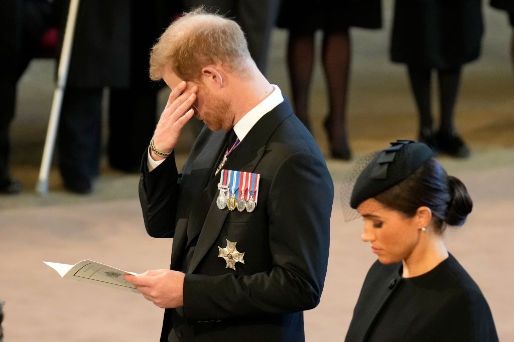 LONDON, UNITED KINGDOM - SEPTEMBER 14: (EMBARGOED FOR PUBLICATION IN UK NEWSPAPERS UNTIL 24 HOURS AFTER CREATE DATE AND TIME) Prince Harry, Duke of Sussex walks behind Queen Elizabeth II's coffin as it is transported on a gun carriage from Buckingham Palace to The Palace of Westminster ahead of her Lying-in-State on September 14, 2022 in London, United Kingdom. Queen Elizabeth II's coffin is taken in procession on a Gun Carriage of The King's Troop Royal Horse Artillery from Buckingham Palace to Westminster Hall where she will lay in state until the early morning of her funeral. Queen Elizabeth II died at Balmoral Castle in Scotland on September 8, 2022, and is succeeded by her eldest son, King Charles III. (Photo by Max Mumby/Indigo/Getty Images)