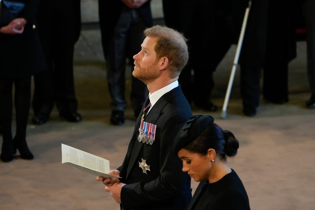 LONDON, UNITED KINGDOM - SEPTEMBER 14: (EMBARGOED FOR PUBLICATION IN UK NEWSPAPERS UNTIL 24 HOURS AFTER CREATE DATE AND TIME) Prince Harry, Duke of Sussex walks behind Queen Elizabeth II's coffin as it is transported on a gun carriage from Buckingham Palace to The Palace of Westminster ahead of her Lying-in-State on September 14, 2022 in London, United Kingdom. Queen Elizabeth II's coffin is taken in procession on a Gun Carriage of The King's Troop Royal Horse Artillery from Buckingham Palace to Westminster Hall where she will lay in state until the early morning of her funeral. Queen Elizabeth II died at Balmoral Castle in Scotland on September 8, 2022, and is succeeded by her eldest son, King Charles III. (Photo by Max Mumby/Indigo/Getty Images)