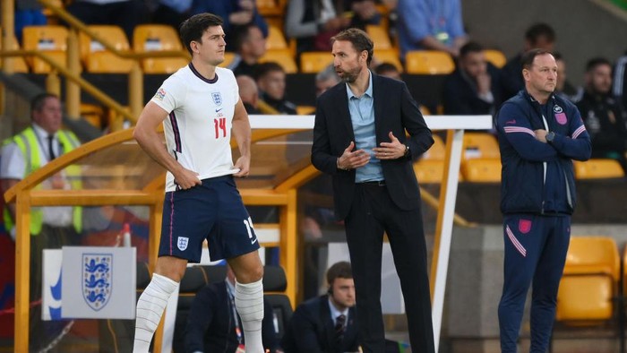 WOLVERHAMPTON, ENGLAND - JUNE 14: Gareth Southgate speaks to Harry Maguire of England before they enter the pitch during the UEFA Nations League - League A Group 3 match between England and Hungary at Molineux on June 14, 2022 in Wolverhampton, England. (Photo by Shaun Botterill/Getty Images)