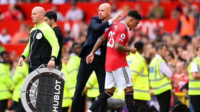 MANCHESTER, ENGLAND - SEPTEMBER 04: Erik ten Hag, Manager of Manchester United interacts with Jadon Sancho of Manchester United during the Premier League match between Manchester United and Arsenal FC at Old Trafford on September 04, 2022 in Manchester, England. (Photo by Michael Regan/Getty Images)