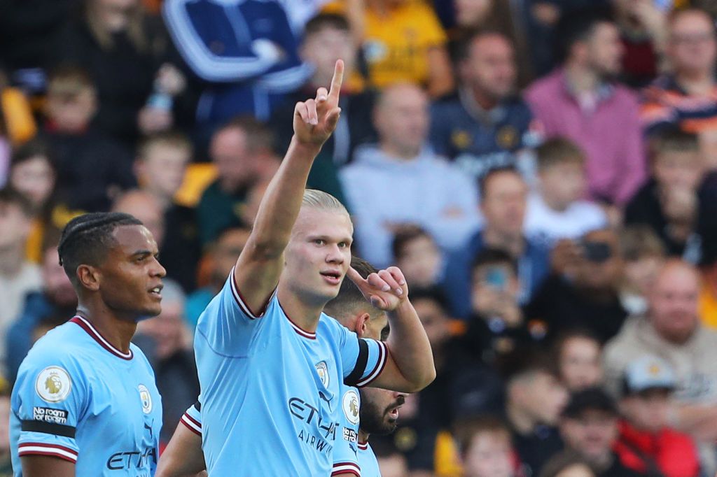 Manchester City's Norwegian striker Erling Haaland celebrates scoring his team's second goal during the English Premier League football match between Wolverhampton Wanderers and Manchester City at the Molineux stadium in Wolverhampton, central England on September 17, 2022. - RESTRICTED TO EDITORIAL USE. No use with unauthorized audio, video, data, fixture lists, club/league logos or 'live' services. Online in-match use limited to 120 images. An additional 40 images may be used in extra time. No video emulation. Social media in-match use limited to 120 images. An additional 40 images may be used in extra time. No use in betting publications, games or single club/league/player publications. (Photo by Geoff Caddick / AFP) / RESTRICTED TO EDITORIAL USE. No use with unauthorized audio, video, data, fixture lists, club/league logos or 'live' services. Online in-match use limited to 120 images. An additional 40 images may be used in extra time. No video emulation. Social media in-match use limited to 120 images. An additional 40 images may be used in extra time. No use in betting publications, games or single club/league/player publications. / RESTRICTED TO EDITORIAL USE. No use with unauthorized audio, video, data, fixture lists, club/league logos or 'live' services. Online in-match use limited to 120 images. An additional 40 images may be used in extra time. No video emulation. Social media in-match use limited to 120 images. An additional 40 images may be used in extra time. No use in betting publications, games or single club/league/player publications. (Photo by GEOFF CADDICK/AFP via Getty Images)