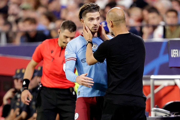 Jack Grealish  (L-R) Jack Grealish of Manchester City, Josep Guardiola of Manchester City.  during the UEFA Champions League  match between Sevilla v Manchester City at the Estadio Ramon Sanchez Pizjuan on September 6, 2022 in Sevilla Spain (Photo by David S. Bustamante/Soccrates/Getty Images)