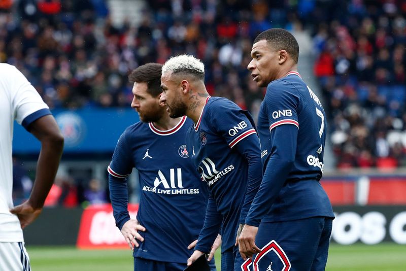 PARIS, FRANCE - MARCH 13: Lionel Messi #30, Neymar Jr #10 and Kylian Mbappe #7 of Paris Saint-Germain look on during the Ligue 1 Uber Eats match between Paris Saint-Germain and Girondins de Bordeaux at Parc des Princes on March 13, 2022 in Paris, France. (Photo by Catherine Steenkeste/Getty Images)