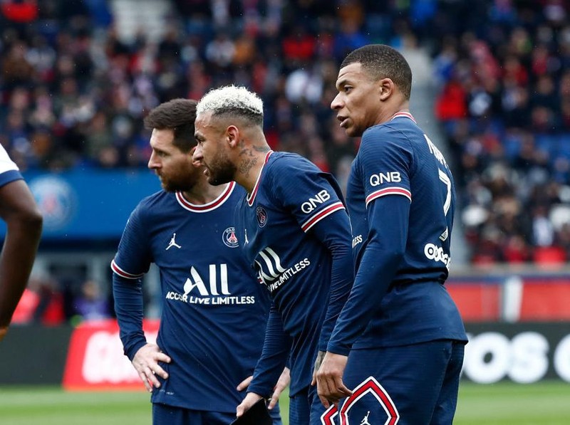 PARIS, FRANCE - MARCH 13: Lionel Messi #30, Neymar Jr #10 and Kylian Mbappe #7 of Paris Saint-Germain look on during the Ligue 1 Uber Eats match between Paris Saint-Germain and Girondins de Bordeaux at Parc des Princes on March 13, 2022 in Paris, France. (Photo by Catherine Steenkeste/Getty Images)