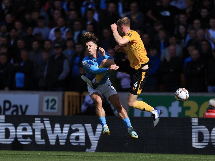 WOLVERHAMPTON, ENGLAND - SEPTEMBER 17: Nathan Collins of Wolverhampton Wanderers fouls Jack Grealish of Manchester City during the Premier League match between Wolverhampton Wanderers and Manchester City at Molineux on September 17, 2022 in Wolverhampton, United Kingdom. (Photo by Simon Stacpoole/Offside/Offside via Getty Images)