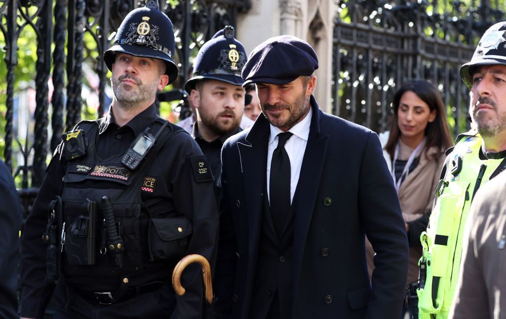 English former football player David Beckham leaves Westminster Hall, at the Palace of Westminster, in London on September 16, 2022 after paying his respects to the coffin of Queen Elizabeth II as it Lies in State. - Queen Elizabeth II will lie in state in Westminster Hall inside the Palace of Westminster, until 0530 GMT on September 19, a few hours before her funeral, with huge queues expected to file past her coffin to pay their respects. (Photo by Louisa Gouliamaki / AFP) (Photo by LOUISA GOULIAMAKI/AFP via Getty Images)