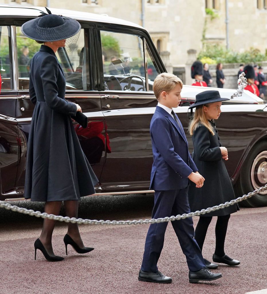 WINDSOR, ENGLAND - SEPTEMBER 19: The Princess of Wales, Prince George and Princess Charlotte arrive at the Committal Service for Queen Elizabeth II held at St George's Chapel in Windsor Castle on September 19, 2022 in Windsor, England. The committal service at St George's Chapel, Windsor Castle, took place following the state funeral at Westminster Abbey. A private burial in The King George VI Memorial Chapel followed. Queen Elizabeth II died at Balmoral Castle in Scotland on September 8, 2022, and is succeeded by her eldest son, King Charles III. (Photo by Kirsty O'Connor - WPA Pool/Getty Images)