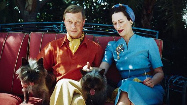The Duke and Duchess of Windsor seated outdoors with two small dogs. (Photo by Bettmann via Getty Images)