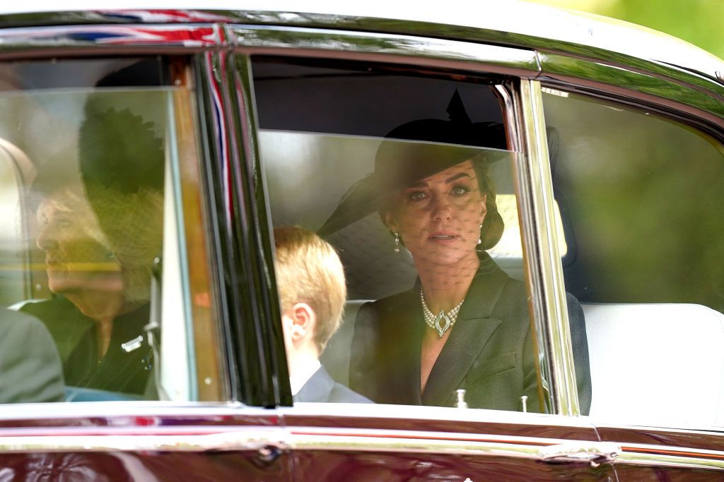 LONDON, ENGLAND - SEPTEMBER 19: Catherine, Princess of Wales is seen in a car during the State Funeral of Queen Elizabeth II at Westminster Abbey on September 19, 2022 in London, England. Elizabeth Alexandra Mary Windsor was born in Bruton Street, Mayfair, London on 21 April 1926. She married Prince Philip in 1947 and ascended the throne of the United Kingdom and Commonwealth on 6 February 1952 after the death of her Father, King George VI. Queen Elizabeth II died at Balmoral Castle in Scotland on September 8, 2022, and is succeeded by her eldest son, King Charles III. (Photo by Sarah Meyssonnier - WPA Pool/Getty Images)