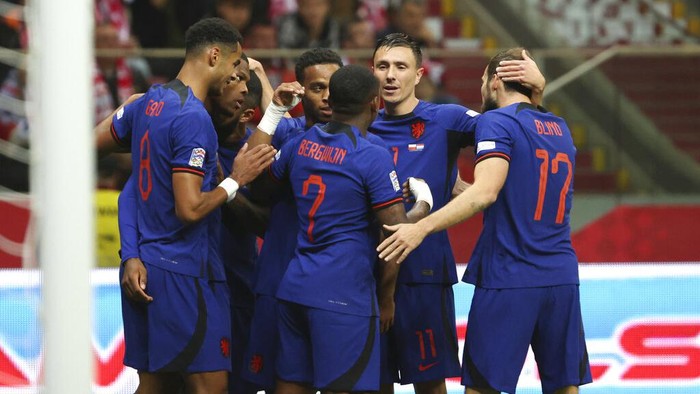 Netherlands players celebrate after Netherlands Cody Gakpo scored his sides opening goal during the UEFA Nations League soccer match between Poland and the Netherlands at the National Stadium in Warsaw, Poland, Thursday, Sept. 22, 2022. (AP Photo/Michal Dyjuk)