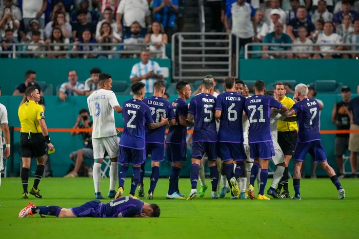 Lionel Messi MIAMI GARDENS, FLORIDA - SEPTEMBER 23: Forward Lionel Messi #10 of Argentina lies on the ground after being fouled during the first half of the international friendly match between Honduras and Argentina at Hard Rock Stadium on September 23, 2022 in Miami Gardens, Florida. (Photo by Eric Espada/Getty Images)