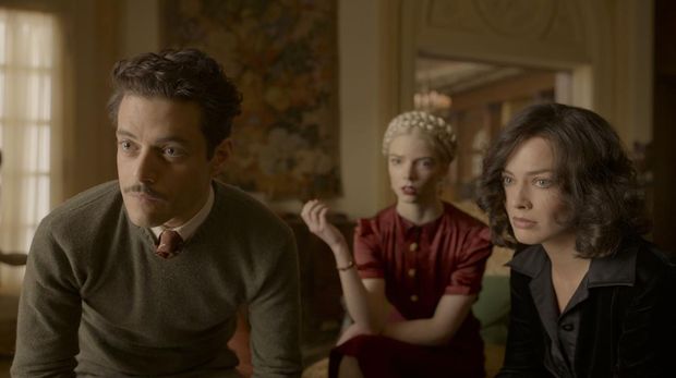 (L-R): John David Washington as Harold Woodman, Margot Robbie as Valerie Voze, and Christian Bale as Burt Berendsen in 20th Century Studios' AMSTERDAM. Photo by Merie Weismiller Wallace; SMPSP. © 2022 20th Century Studios. All Rights Reserved.