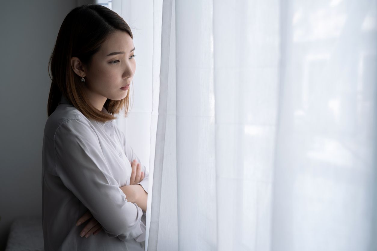 Asian woman with stress, She kept herself alone in her bedroom, Depression.