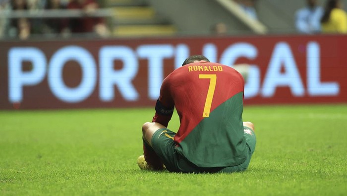 Portugals Cristiano Ronaldo sits on the field during the UEFA Nations League soccer match between Portugal and Spain at the Municipal Stadium in Braga, Portugal, Tuesday, Sept. 27, 2022. (AP Photo/Luis Vieira)