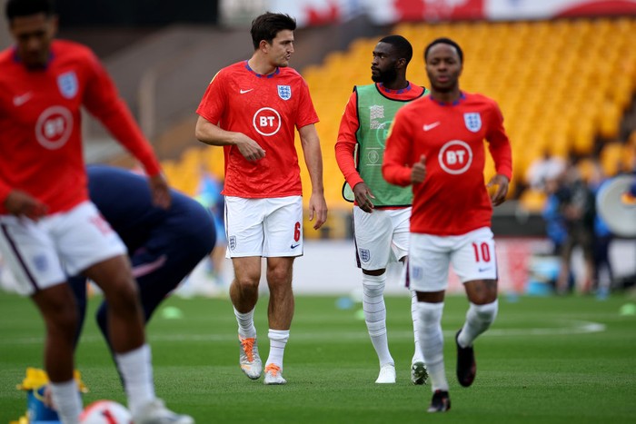 WOLVERHAMPTON, ENGLAND - JUNE 11: Harry Maguire and Fikayo Tomori of England speak prior to the UEFA Nations League League A Group 3 match between England and Italy at Molineux on June 11, 2022 in Wolverhampton, England. (Photo by Eddie Keogh - The FA/The FA via Getty Images)