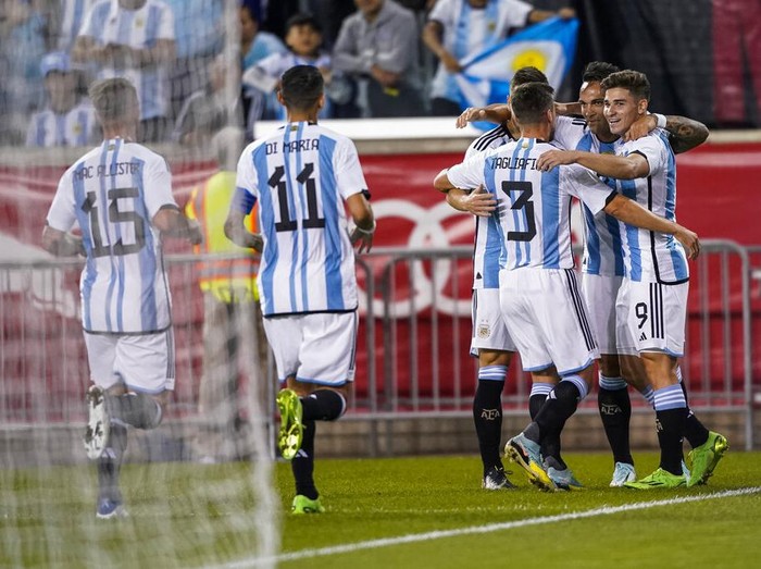 Argentina's players celebrate their first goal scored by Julian Alvarez (9) during the first half of an international friendly soccer match against Jamaica on Tuesday, Sept. 27, 2022, in Harrison, N.J. (AP Photo/Eduardo Munoz Alvarez)