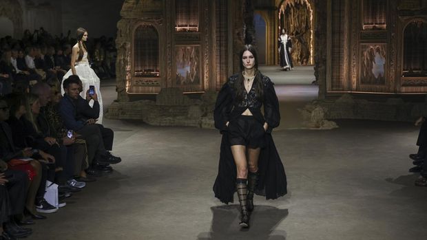 A model wears a creation for the Dior Spring/Summer 2023 fashion collection presented Tuesday, Sept. 27, 2022 in Paris. (Photo by Vianney Le Caer/Invision/AP)